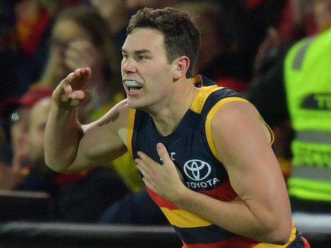 Mitch McGovern of the Crows reacts after a goal during the Round 22 AFL match between the Adelaide Crows and the Sydney Swans at Adelaide Oval in Adelaide, Friday, August 18, 2017. (AAP Image/David Mariuz) NO ARCHIVING, EDITORIAL USE ONLY