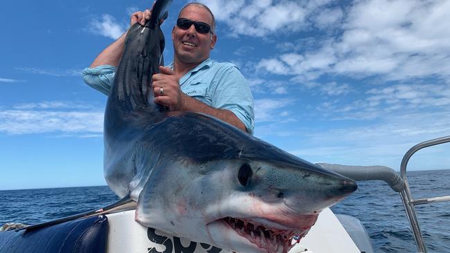 Dan Gilbertson, operator of GT Fishing Charters, and a Mako shark, which he said can look like a Great White if you’re not used to spotting them. Picture: Supplied