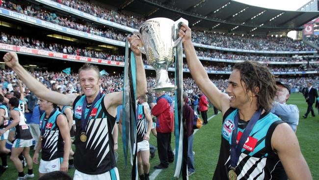 Dean Brogan (left) after playing in Port’s 2004 premiership.