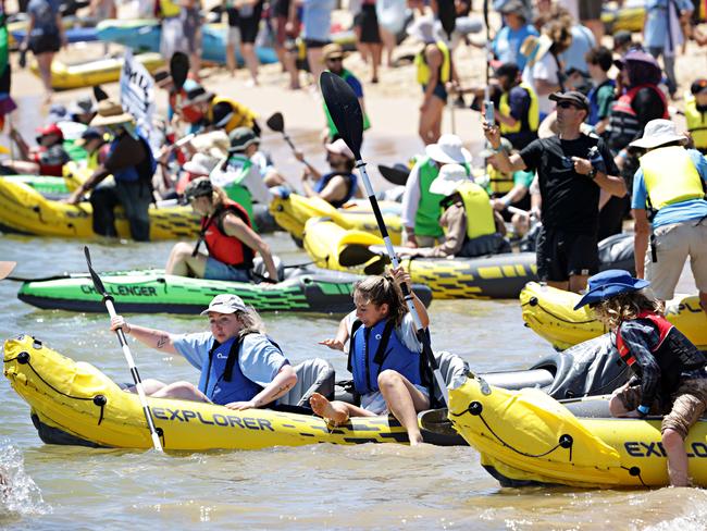 Rising Tide protesters in kayaks at Horseshoe Beach in Newcastle. Photographer: Adam Yip