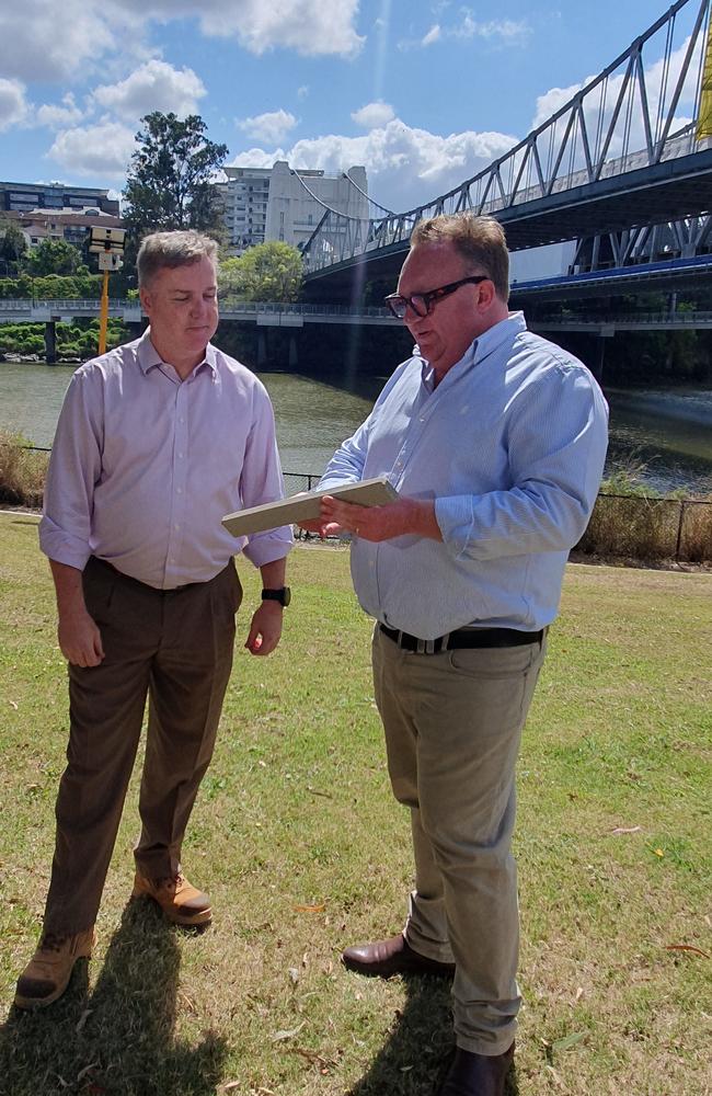 Mr Miney (left) and Mr Wines with a sample of the new decking material. Picture: Celeste Muller