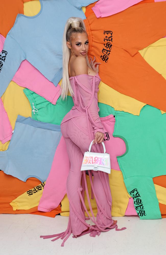 The fitness influencer looked incredible in a skin-tight pink outfit. Picture: Brendon Thorne/Getty Images