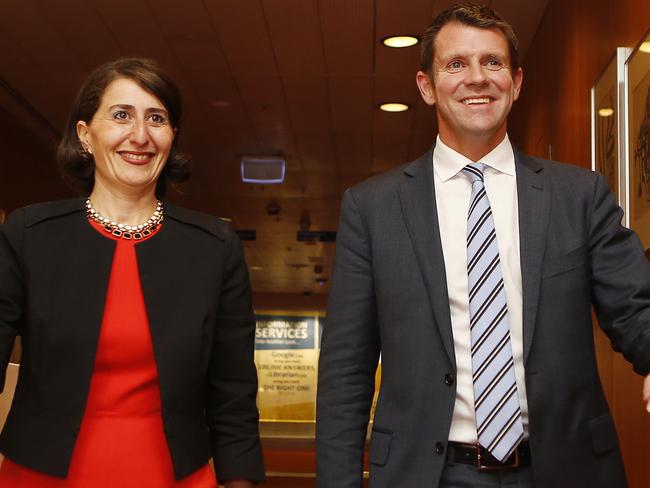 Purposeful: Treasurer Gladys Berejiklian strides to a press conference at NSW Parliament in Sydney with Premier-elect Mike Baird in 2014. Now she’s in line to walk the same walk. Picture: AAP