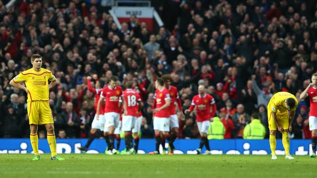 Steven Gerrard of Liverpool looks dejected after United’s third goal.