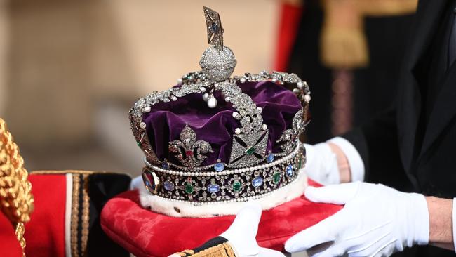 The Imperial State Crown arrives through the Sovereign's Entrance at the Palace of Westminster.