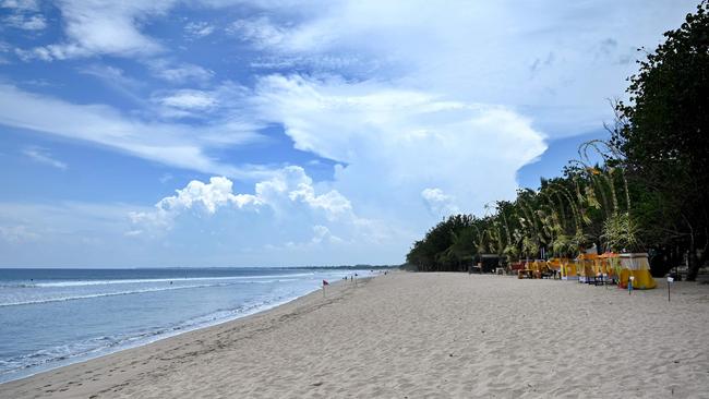 Usually packed Bali beaches are now empty, with coronavirus travel restrictions stopping an influx of tourists. Picture: Sonny Tumbelaka.