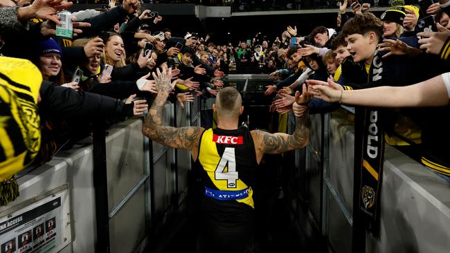 MELBOURNE, AUSTRALIA - JUNE 15: Dustin Martin of the Tigers is chaired from the field after his 300th match by teammates Tom Lynch (left) and Toby Nankervis (right0 during the 2024 AFL Round 14 match between the Richmond Tigers and the Hawthorn Hawks at The Melbourne Cricket Ground on June 15, 2024 in Melbourne, Australia. (Photo by Michael Willson/AFL Photos via Getty Images)