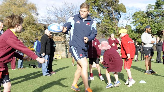 Damien Fitzpatrick running a rugby clinic.