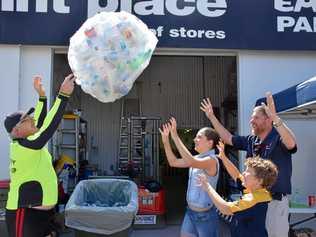 GIVING BACK: Trash walker, Mike Murphy donates another bag of recyclable bottles to Veronica May (12), Zachary May (9) and Kingaroy scout leader Craig Turnley. Picture: Matt Collins