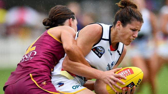 Jessica Foley (right) of the Crows is tackled by Sophie Conway (left) of the Lions during the Round 1 AFLW match between the Brisbane Lions and Adelaide Crows at Hickey Park in Brisbane, Saturday, February 8, 2020. (AAP Image/Darren England) NO ARCHIVING, EDITORIAL USE ONLY