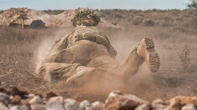 A soldier from the 5th Battalion, Royal Australian Regiment, crawls forward during a live fire attack exercise. Picture: Supplied