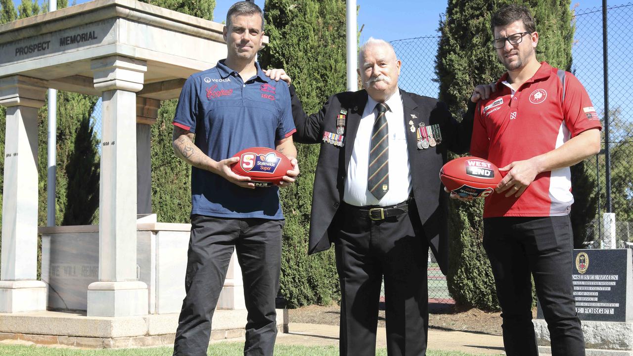 North Adelaide coach Josh Carr and Norwood coach Jarrod Cotton at Prospect Memorial, with Prospect RSL President, John Hadaway. 24 April 2019. Picture Dean Martin