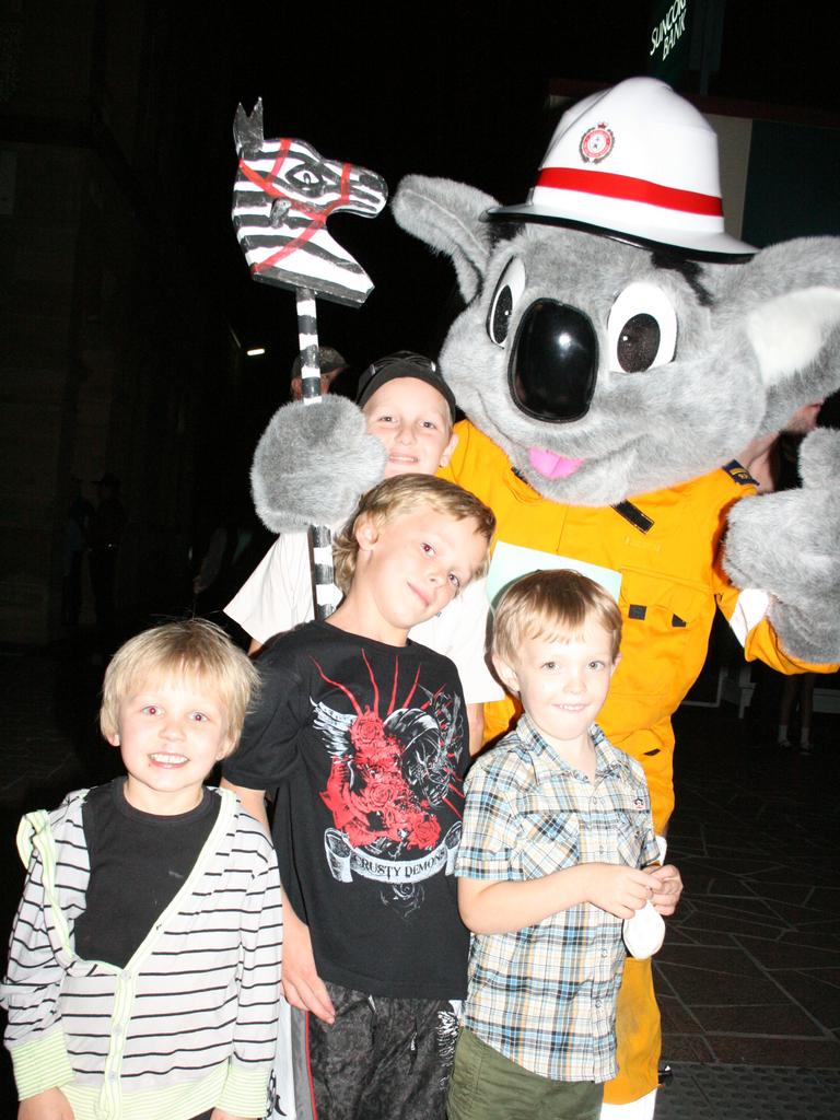 <p>Cooper Spies, Robert Drennert, Daniel Eames and Hunter Smith get up close and personal with Blazer Bear at the Mardi Gras. Photo Deanna Millard / Warwick Daily News</p>