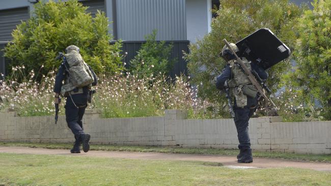 Officers from the Special Emergency Response Team on the scene of a standoff between police and an armed gunman at a Park St address in Newtown on December 21, 2022.