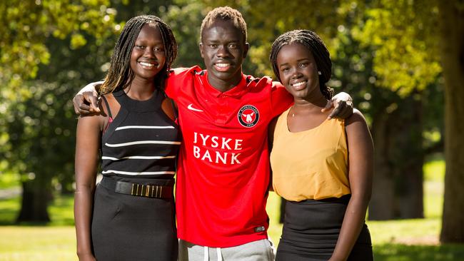 Bor Mabil, right, with her cousin Abiei Ajak and brother Awer Mabil in 2015. Picture: James Elsby/The Australian