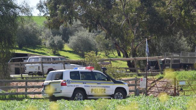 Police at the Sandy Creek property. Picture Jason Katsaras