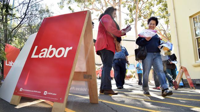 Voters make their way to the polling booth today.