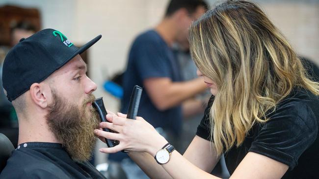 Footballer Max Gawn shaves off his iconic beard off this morning at Kings Domain Barbershop, in partnership with new sports App 20FOUR. Picture: Mark Stewart