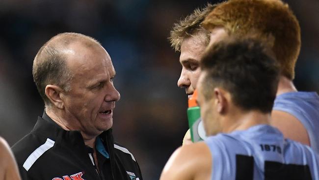 A disappointed Ollie Wines talks with Ken Hinkley at quarter-time. Picture: AAP Image/Julian Smith