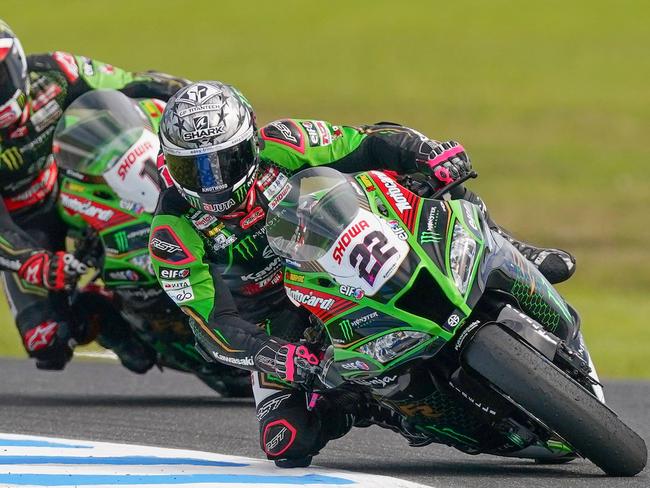 Alex Lowes riding the #22 Kawasaki Racing Team Kawasaki leads Jonathan Rea on the final lap as he wins at Phillip Island, Victoria, Sunday, March 1, 2020. (AAP Image/Scott Barbour)