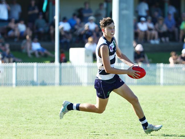 Zayne Moore, 16, gets a kick away in the AFL Cairns Pride Round clash between the Port Douglas Crocs and the South Cairns Cutters at Port Douglas. Picture: Brendan Radke