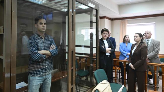 US journalist Evan Gershkovich, arrested on espionage charges, stands inside a defendants' cage. Picture: AFP