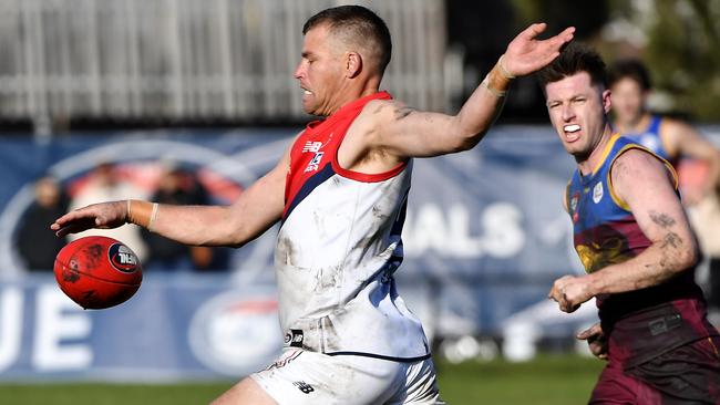 Brenton Keating gets a kick for Diamond Creek. Picture: Andrew Batsch