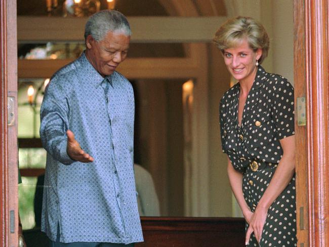 President Nelson Mandela escorts Diana, Princess of Wales, in South Africa in 1997. Picture: AP