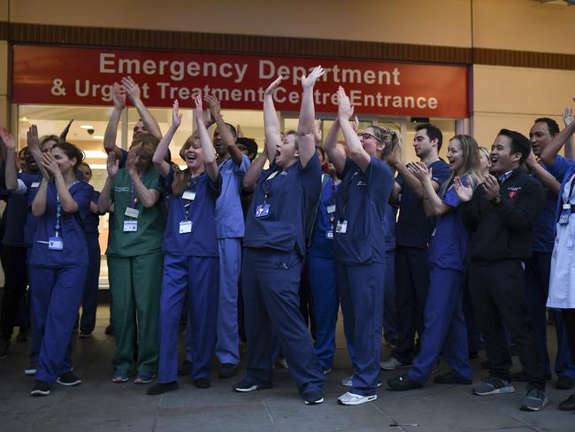 Medical workers clap outside the Chelsea and Westminster Hospital in London during the weekly “Clap for our Carers” amid the coronavirus pandemic. Picture: Alberto Pezzali