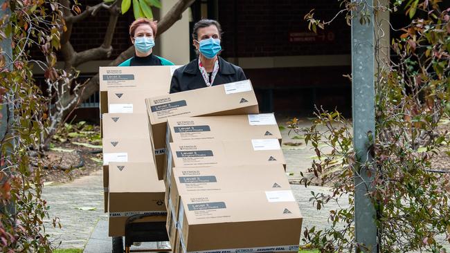 Thebarton Senior College Principal Eva Kannis-Torry and wellbeing leader Libby Branford, with masks for their students. Picture: Tom Huntley