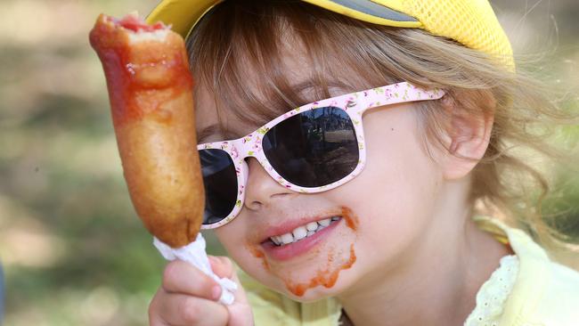 A sausage, deep fried in batter, smothered in tomato sauce — a staple food item at royal shows across the county.