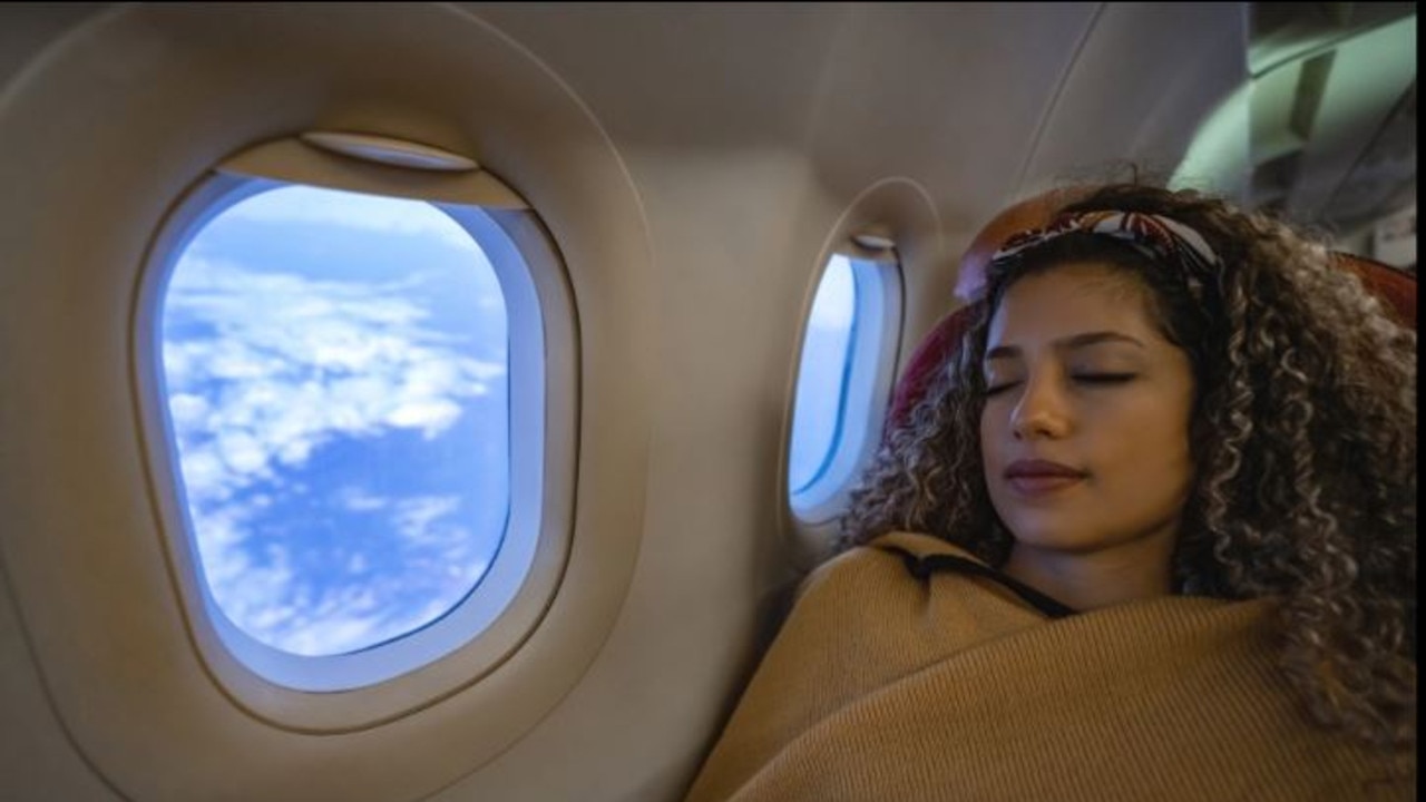 If you’re arriving at your destination in the morning, maximising the amount of sleep on the plane is the priority, experts say.