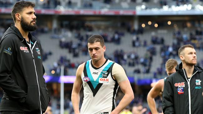 Paddy Ryder, Tom Rockliff and Robbie Gray leave Optus Stadium after Port Adelaide’s Round 17 loss to Fremantle. Picture: Paul Kane (Getty).