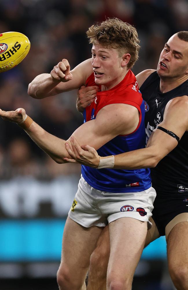 Melbourne, Australia. 02nd June, 2023. Alex Cincotta of Carlton tackles  Kysaiah Pickett of Melbourne during the AFL Round 12 match between the  Melbourne Demons and the Carlton Blues at the Melbourne Cricket