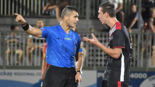 Daniel Simic is yellow carded in Magpies Crusaders v Sunshine Coast Fire in the FQPL1 at Sologinkin Oval. Saturday, March 19, 2022. Picture: Tara Miko