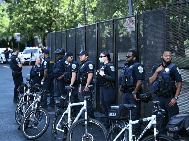 Police stand guard outside the Watergate hotel as pro-Palestinian activists demonstrate ahead of the visit of Israeli Prime Minister Benjamin Netanyahu. Picture: AFP