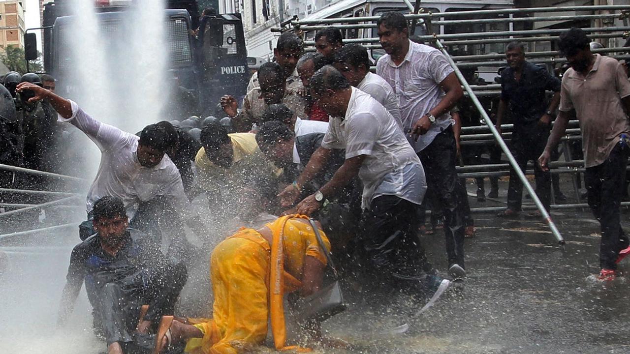 Police use water canon to disperse farmers taking part in an anti-government protest demanding the resignation of Sri Lanka's President Gotabaya Rajapaksa over the country's ongoing economic crisis in Colombo. Picture: AFP