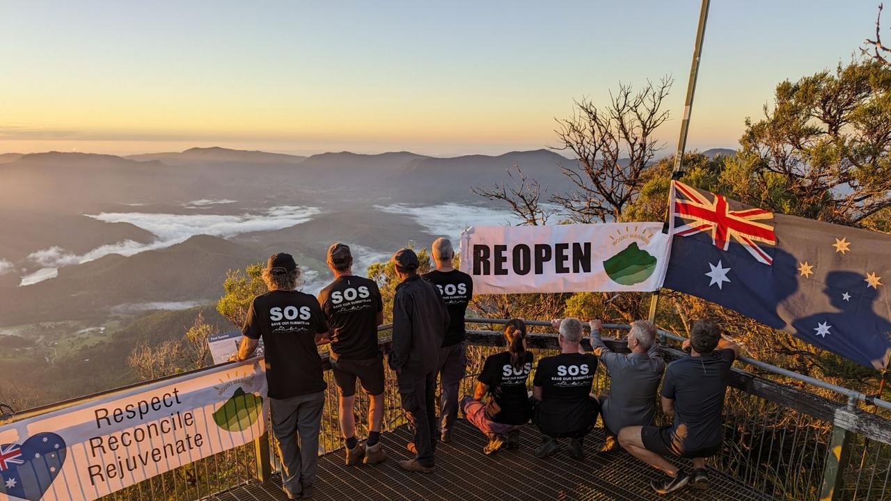 Earlier: Hikers defied a climbing ban at Mount Warning/Wollumbin in the Tweed to scale the summit for an Australia Day sunrise. Picture: Adrian Hoffman