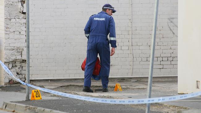 Forensic police near the scene of the brutal rape in December, 2006.