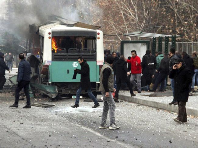 A public bus is burning at the scene of a car bomb attack in central Anatolian city of Kayseri, Turkey. Picture: IHA via AP