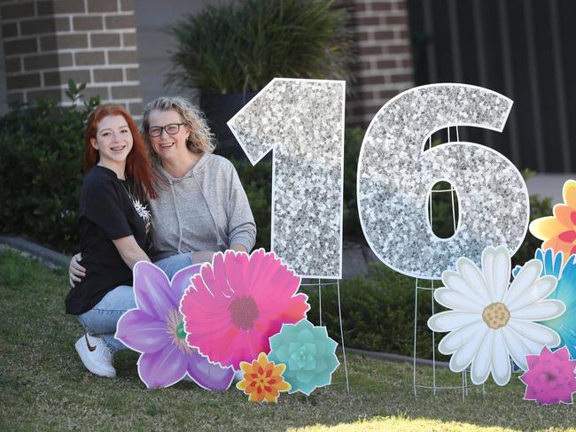 Amelia Holloway-Brown with her mum Belinda Spackman-Brown at their Woongarrah home which has become their business Sign Fairy AU. Picture: Sue Graham