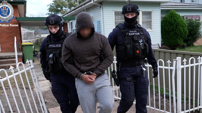 Raptor Squad arrest a Birrong man following an early morning raid on Friday. Picture: NSW Police