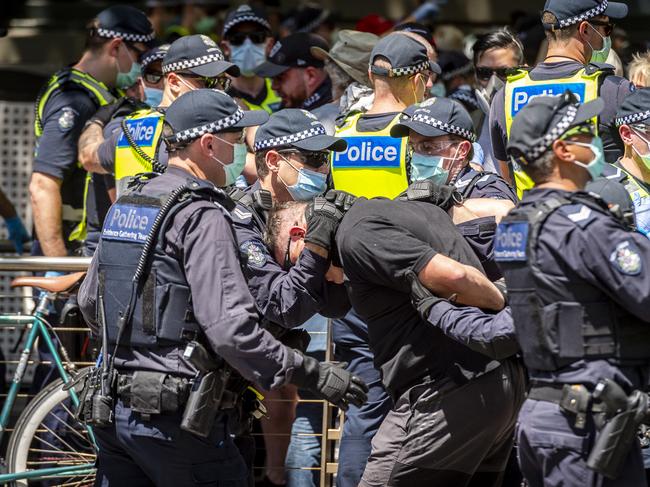 Anti-lockdown protesters are arrested in Melbourne. Picture: Jake Nowakowski