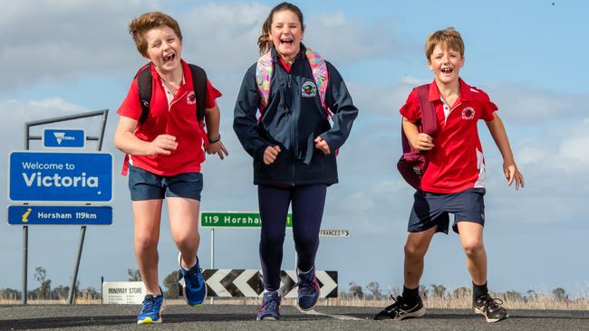 Victorian children Matthew Bird, Eva Sambell, and Gus Sambell are returning to school in South Australia. Picture: Jason Edwards