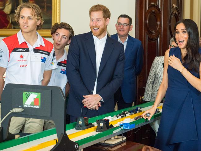 Meghan got a fright during a Formula One demo by kids from Melbourne’s Trinity Grammar. Picture: Getty