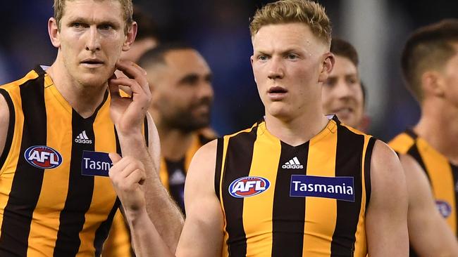 Ben McEvoy (left) and James Sicily of the Hawks react after the Round 20 AFL match between the North Melbourne Kangaroos and the Hawthorn Hawks at Marvel Stadium in Melbourne, Friday, August 2, 2019.  (AAP Image/Julian Smith) NO ARCHIVING, EDITORIAL USE ONLY