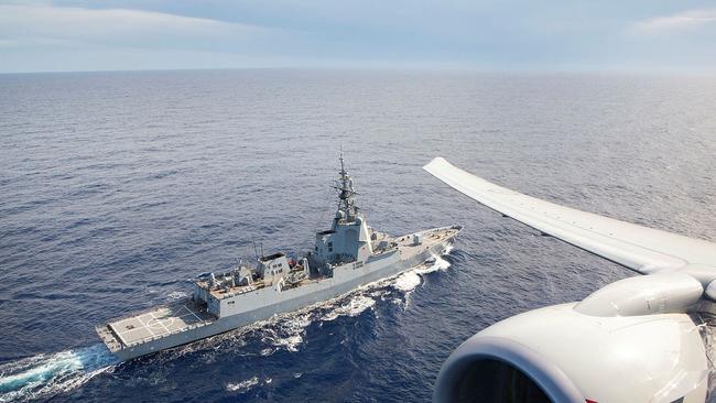 P-8A Poseidon maritime surveillance aircraft flies over air warfare destroyer HMAS Hobart. Picture: Defence