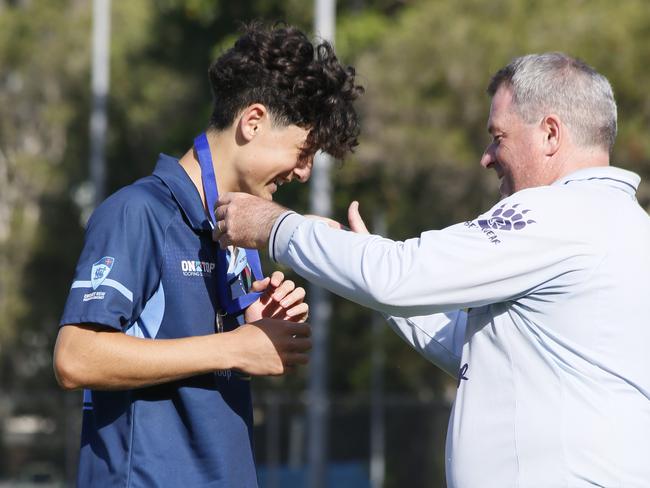 Player of the match Billy Martin receives the Kevin Cunningham Medal. Picture: Warren Gannon Photography