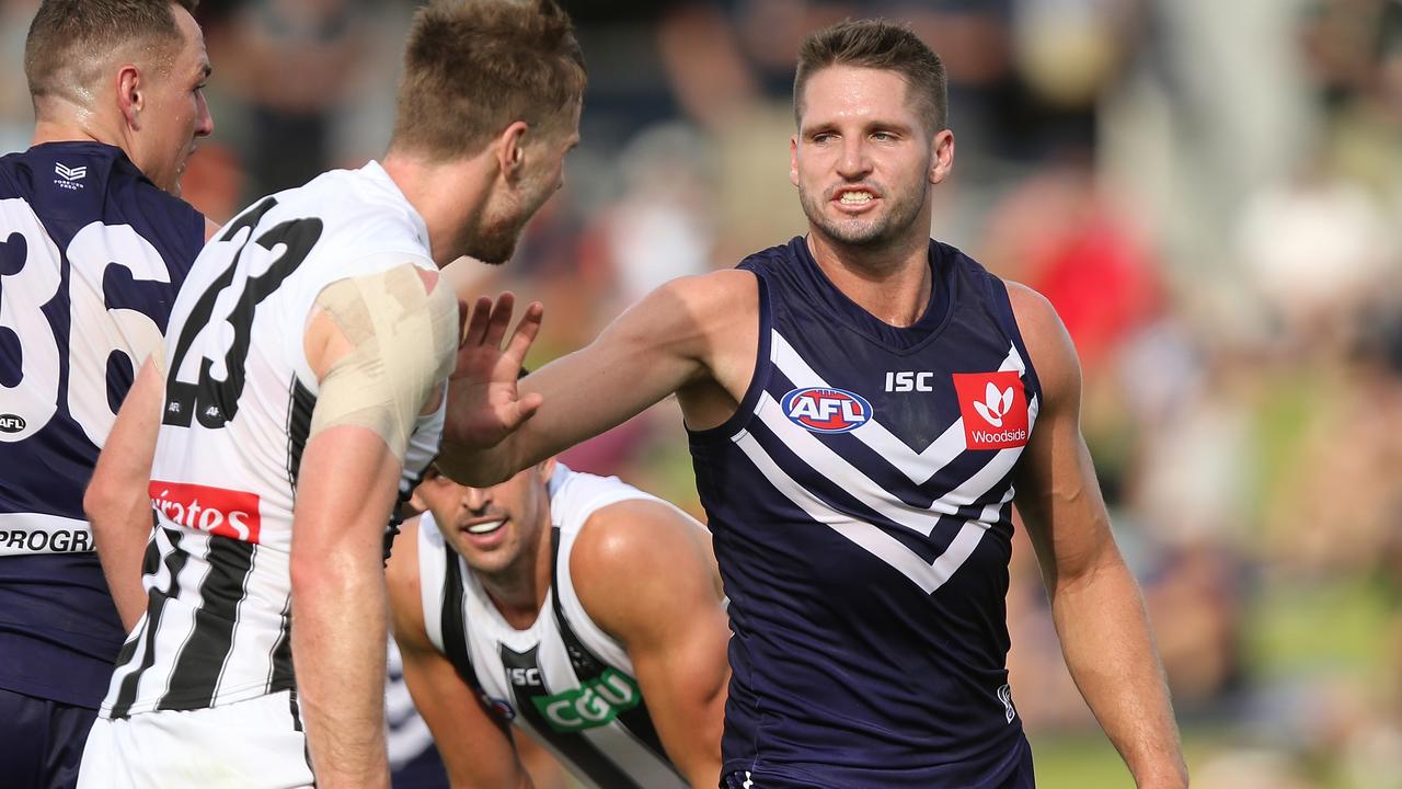 Jesse Hogan clashes with Collingwood defender Jordan Roughead this month.