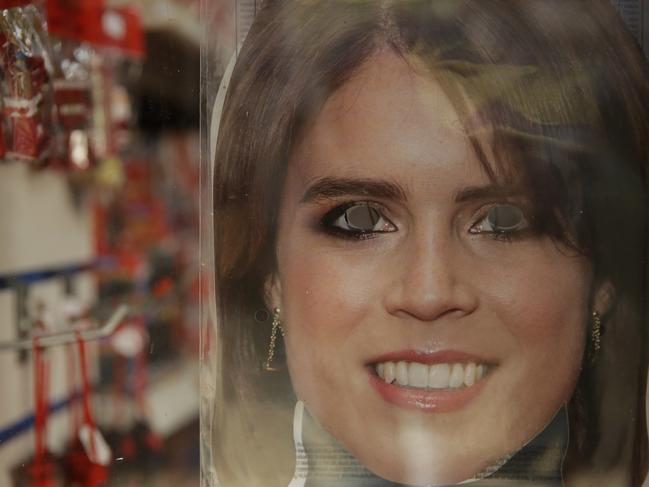 A Princess Eugenie mask is displayed for sale in the window of a souvenir shop ahead of the wedding. Picture: AP